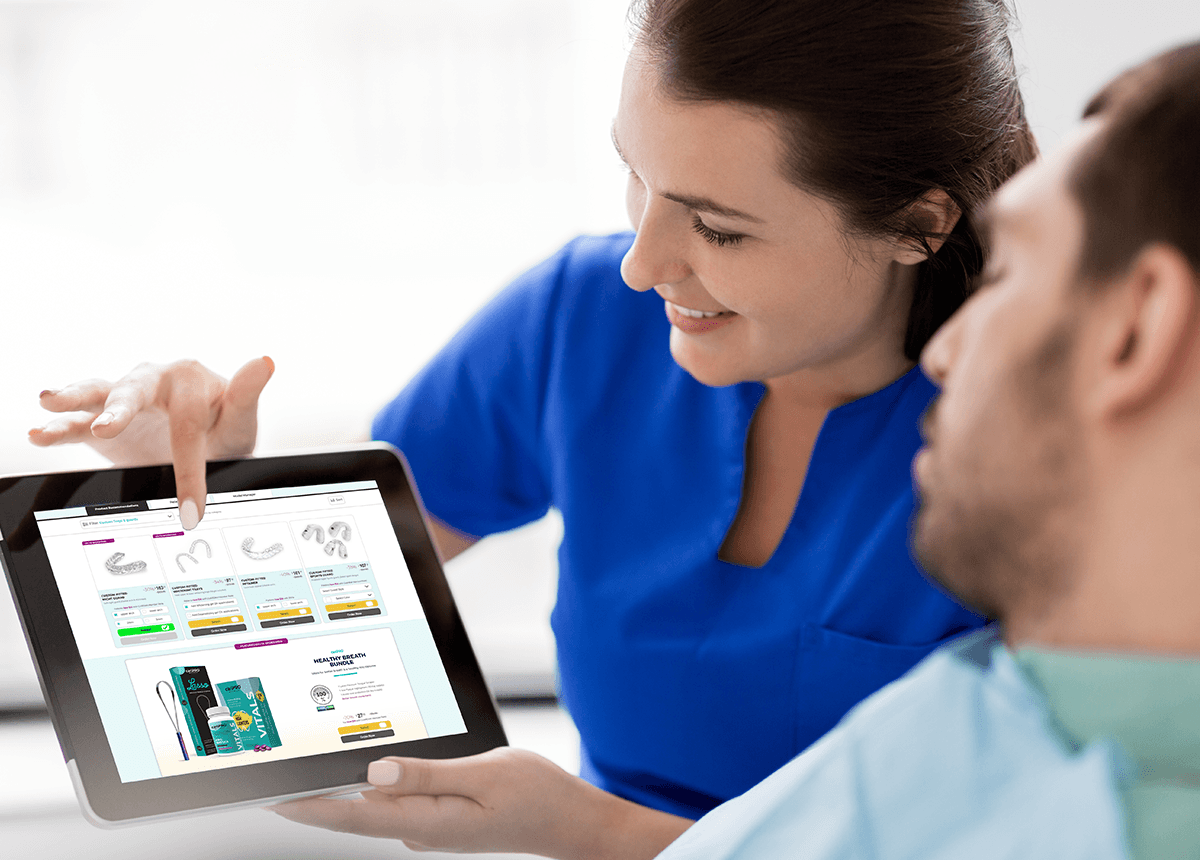 Dentist using the recommendation engine on a tablet
